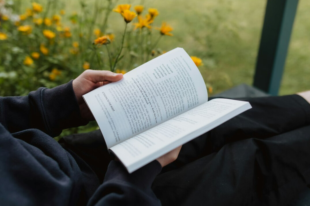 person reading old book